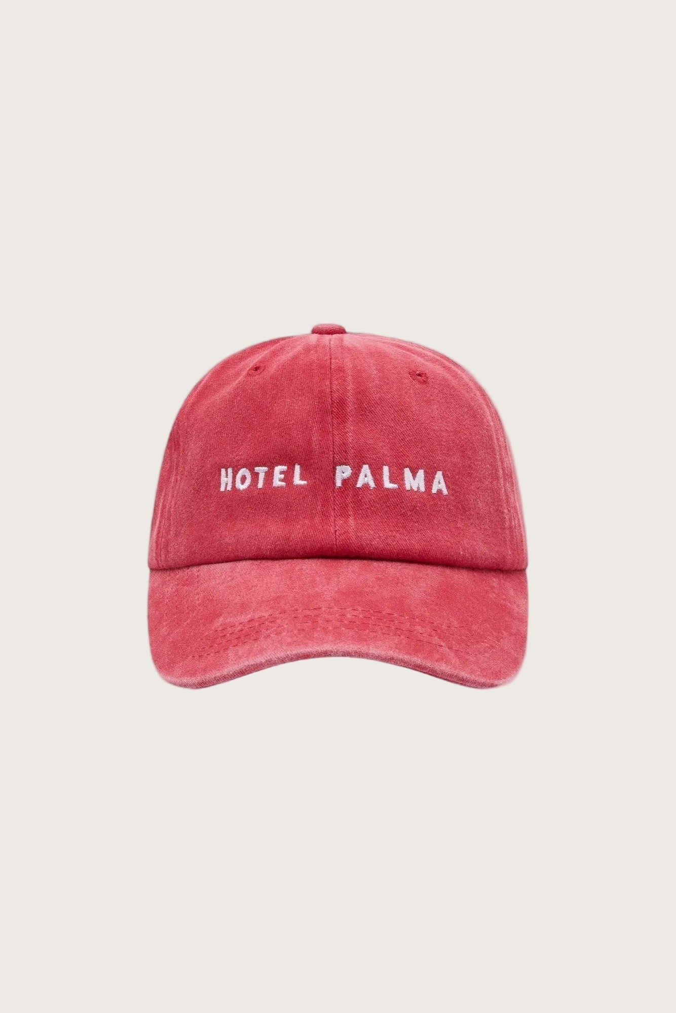 Red stonewash vintage look cap with embroidered text 'Hotel Palma"