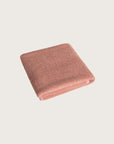 Købn Clay Bathmat folded with a plush pile chunky cotton weave