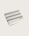 Købn Crema Towel featuring raw edge fringing folded