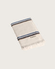 Købn Ecru Hand Towel featuring raw edge fringing folded