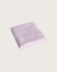 Købn Lilac Bathmat folded with a plush pile chunky cotton weave
