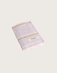 Købn Lilac Hand Towel featuring raw edge fringing folded