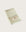 Folded mint hand  towel with stripes and 'kobn' branding on a light beige background