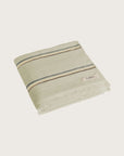 Købn Matcha Towel featuring raw edge fringing folded