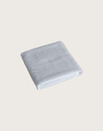 Købn Mist Bathmat folded with a plush pile chunky cotton weave
