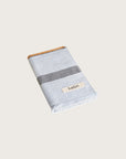 Købn Mist Hand Towel featuring raw edge fringing folded