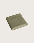 Købn Olive Bathmat folded with a plush pile chunky cotton weave