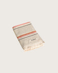 Købn Sand Hand Towel featuring raw edge fringing folded