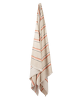 Beige towel with pink stripes on a white background