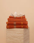 Kobn Tamarillo Bathroom Set featuring contrast stripes and fringing with 2 towels, 1 hand towel and 1 bathmat.