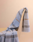 Luxury Mist towel with stripes draped on a chair