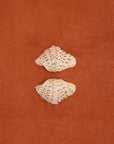 Clam shell pair on a textured cotton bath mat in Tamarillo colour by Kobn