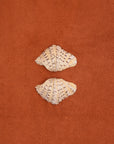 Clam shell pair on a textured cotton bath mat in Tamarillo colour by Kobn