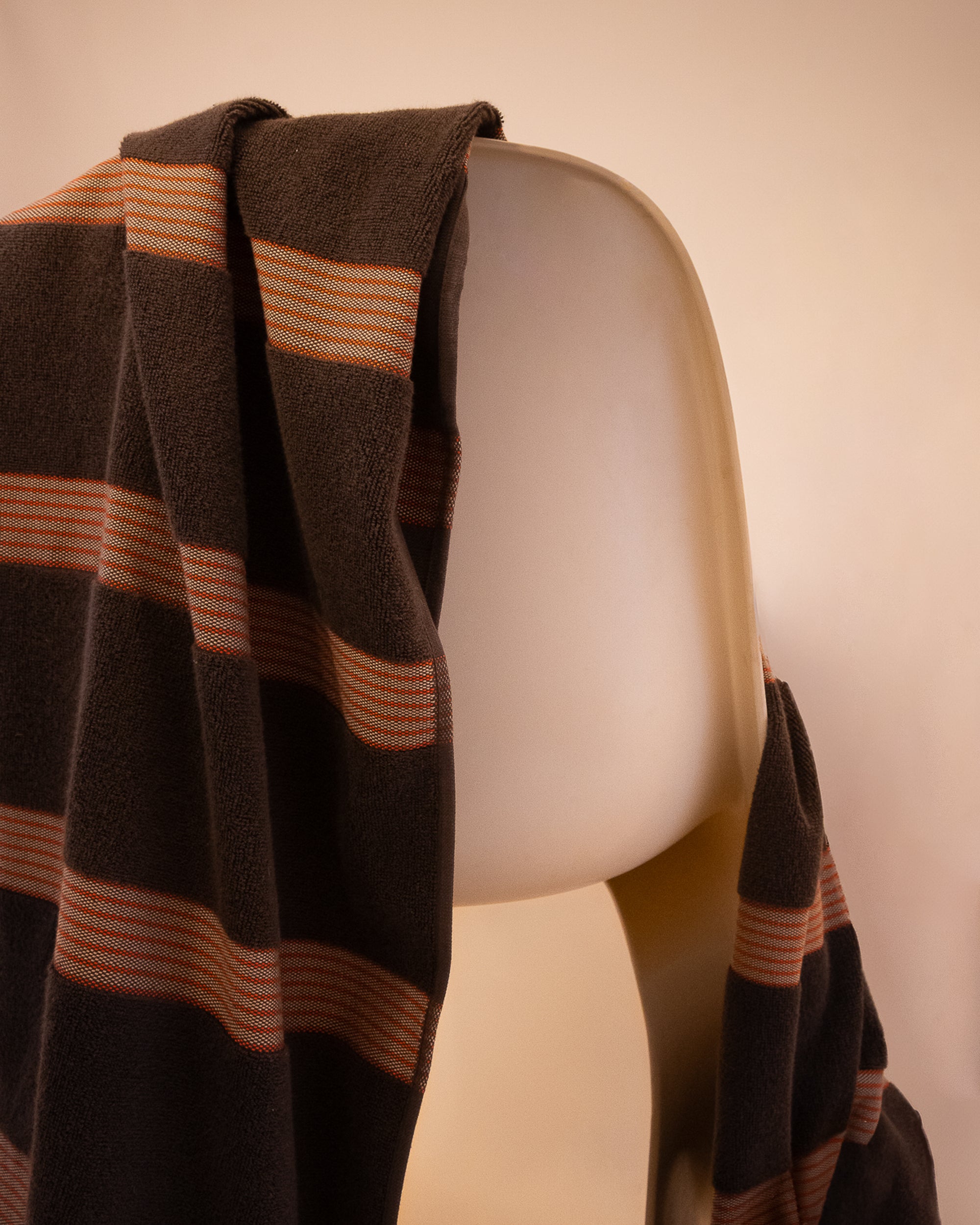 Kobn Umber towel draped on a chair