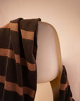 Kobn Umber towel draped on a chair