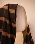 Kobn Umber towel draped on a chair