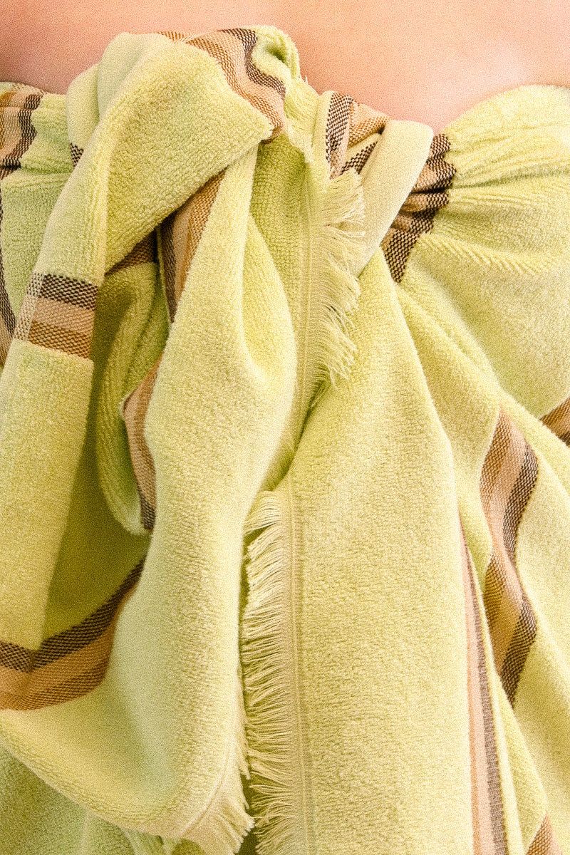 Group of striped kobn towels in different colours. 