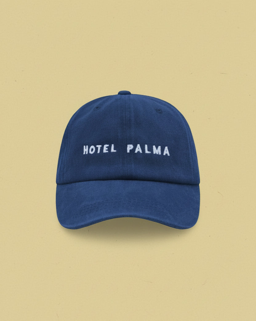 Little Palma cotton blue cap with words Hotel Palma embroidered on the front. 