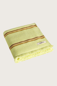 Købn Citrus Towel featuring raw edge fringing folded 