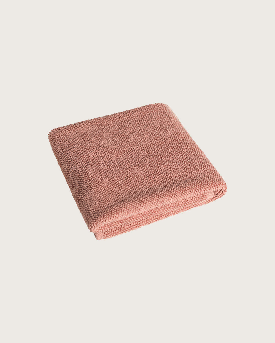 Købn Clay Bathmat folded with a plush pile chunky cotton weave