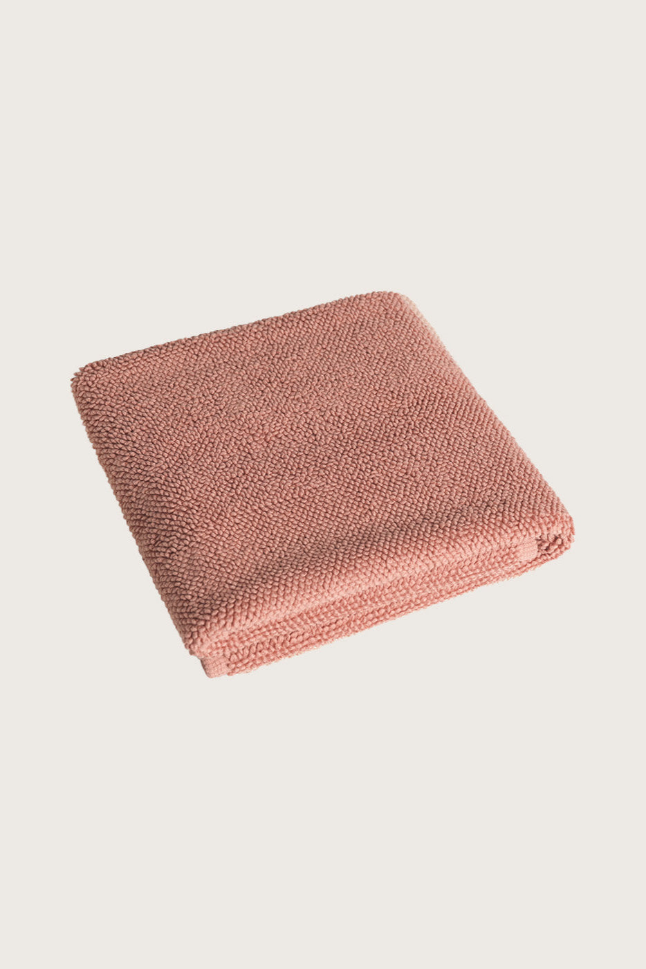 Købn Clay Bathmat folded with a plush pile chunky cotton weave