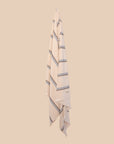 Striped kobn towel in ecru colour with blue stripes hanging on a beige background
