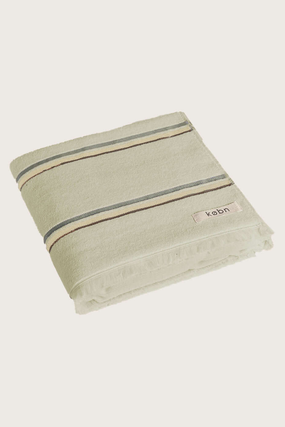 Købn Matcha Towel featuring raw edge fringing folded 