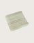 Light Green towel with multi coloured stripe folded on a white background