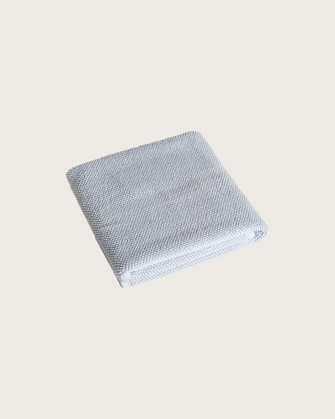 Købn Mist Bathmat folded with a plush pile chunky cotton weave