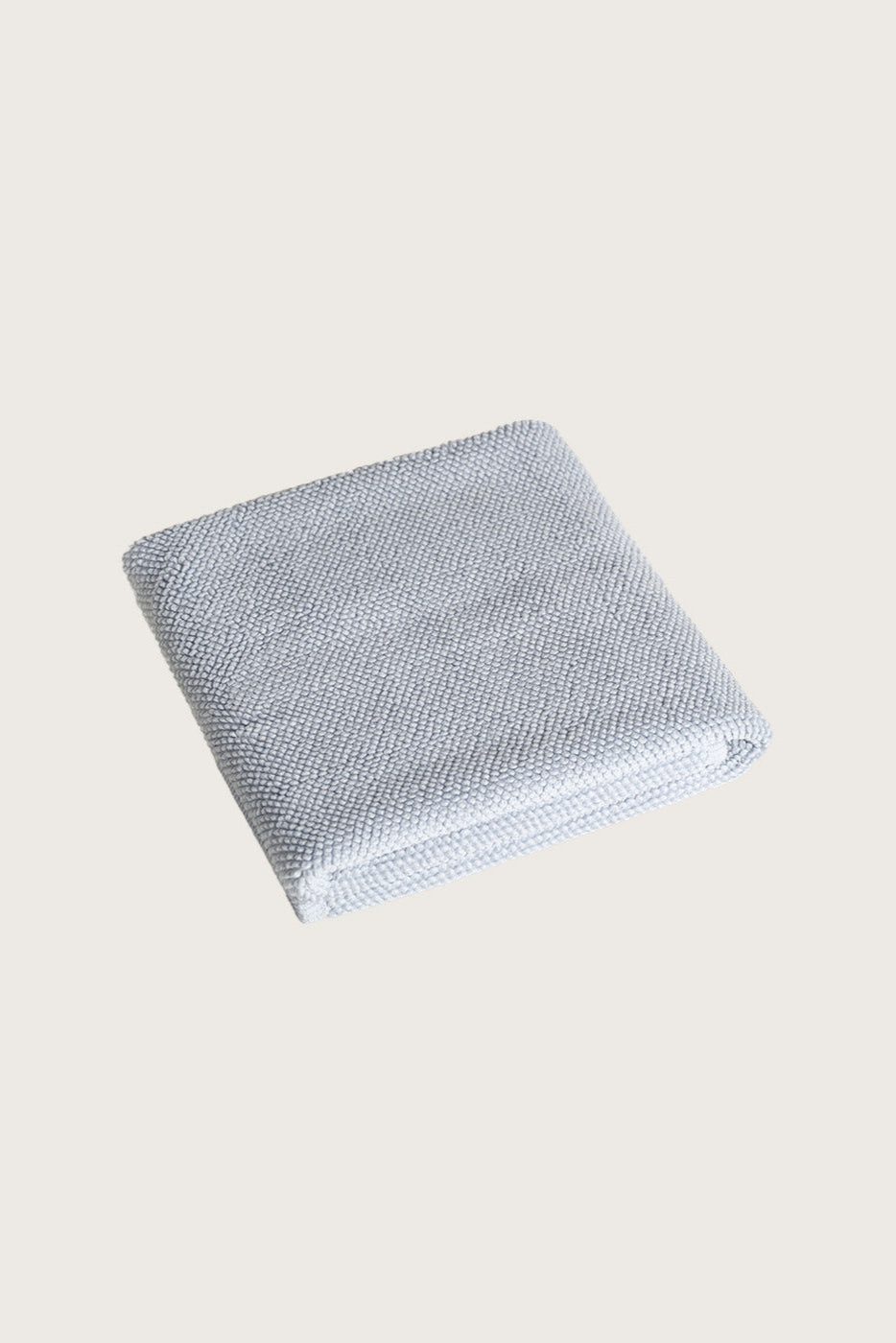 Købn Mist Bathmat folded with a plush pile chunky cotton weave