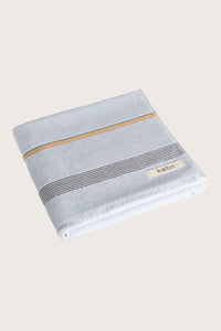Købn Mist Towel featuring raw edge fringing folded 