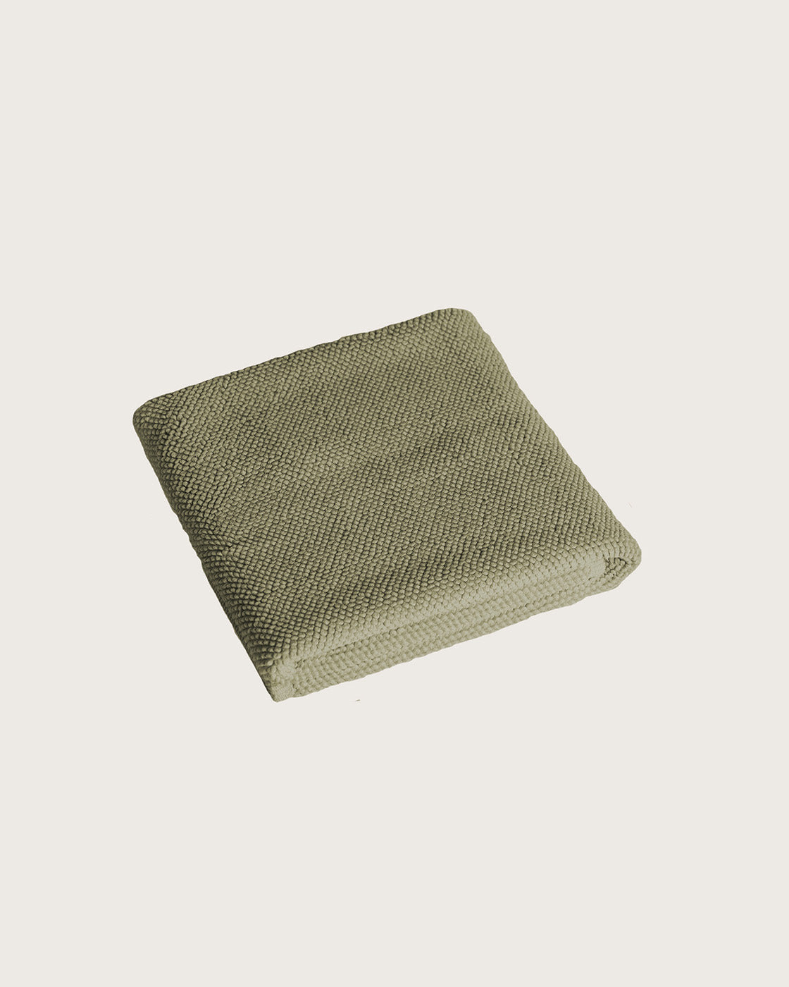Købn Olive Bathmat folded with a plush pile chunky cotton weave