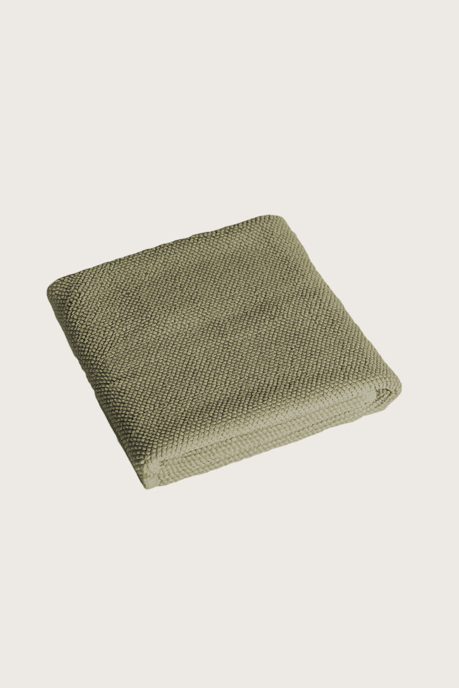 Købn Olive Bathmat folded with a plush pile chunky cotton weave