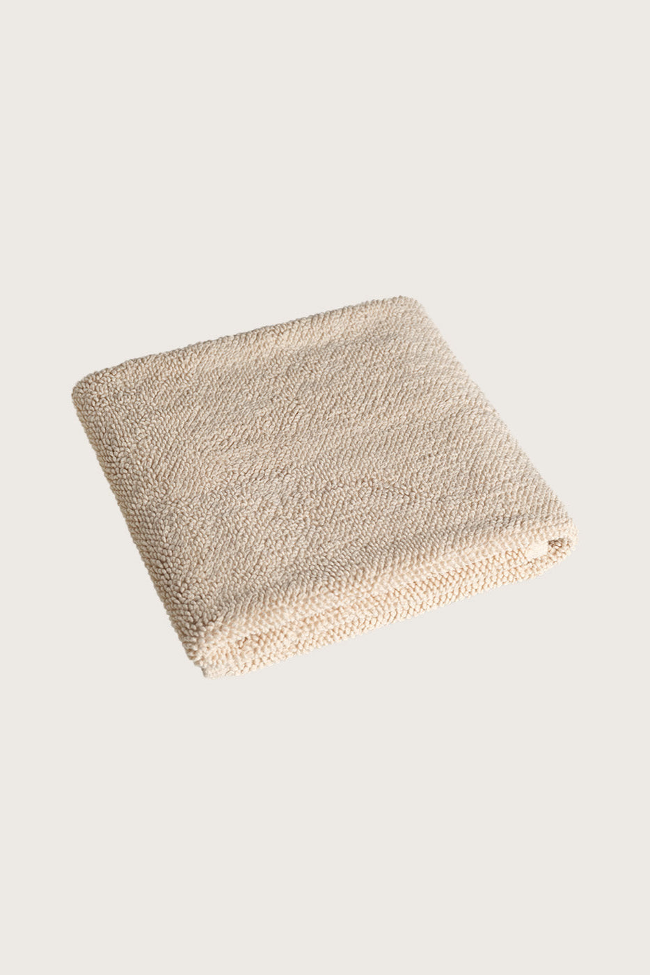 Købn Sand Bathmat folded with a plush pile chunky cotton weave