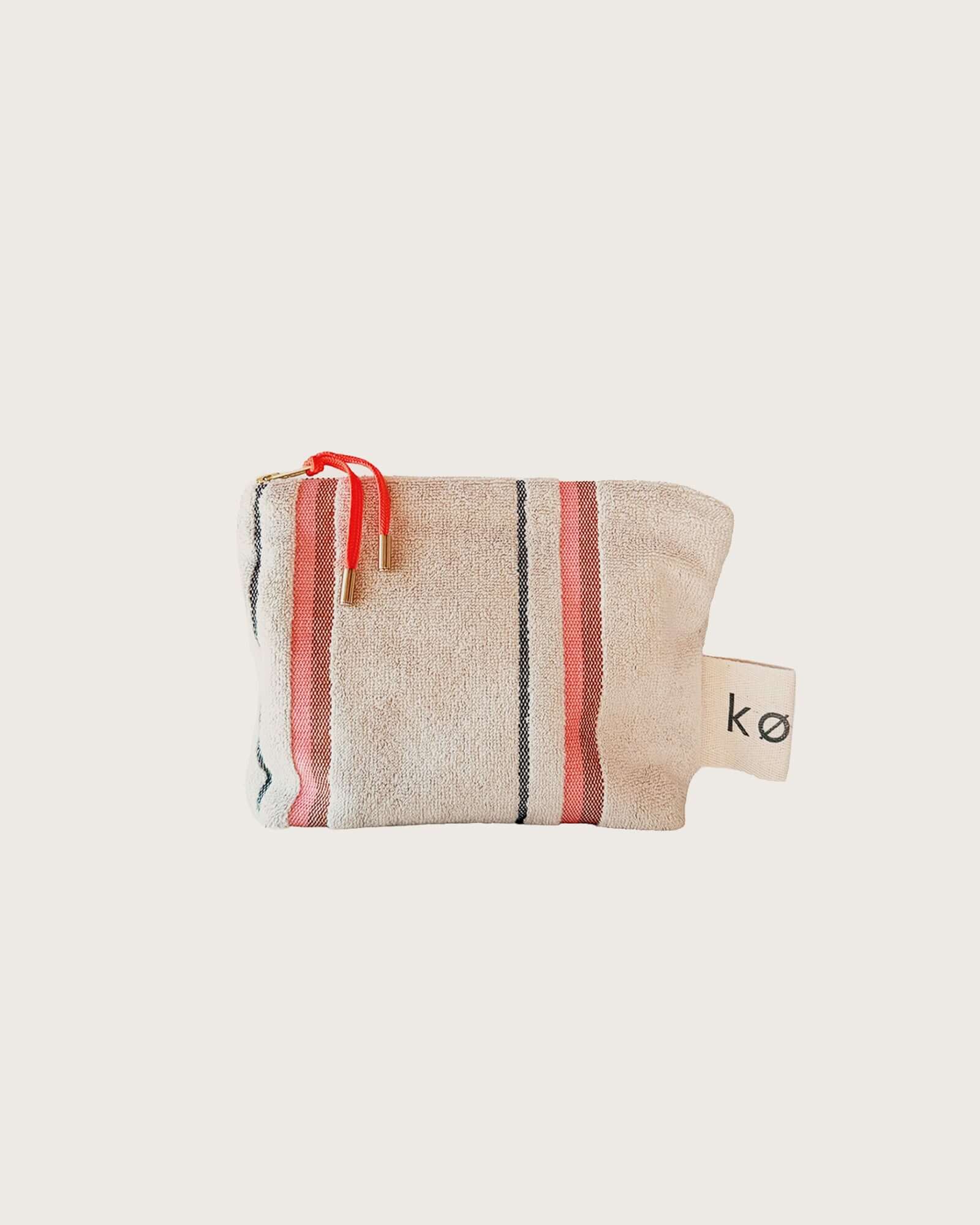 Kobn Sand Small Pouch with stripes for travel, to use in your bag, or as a clutch.