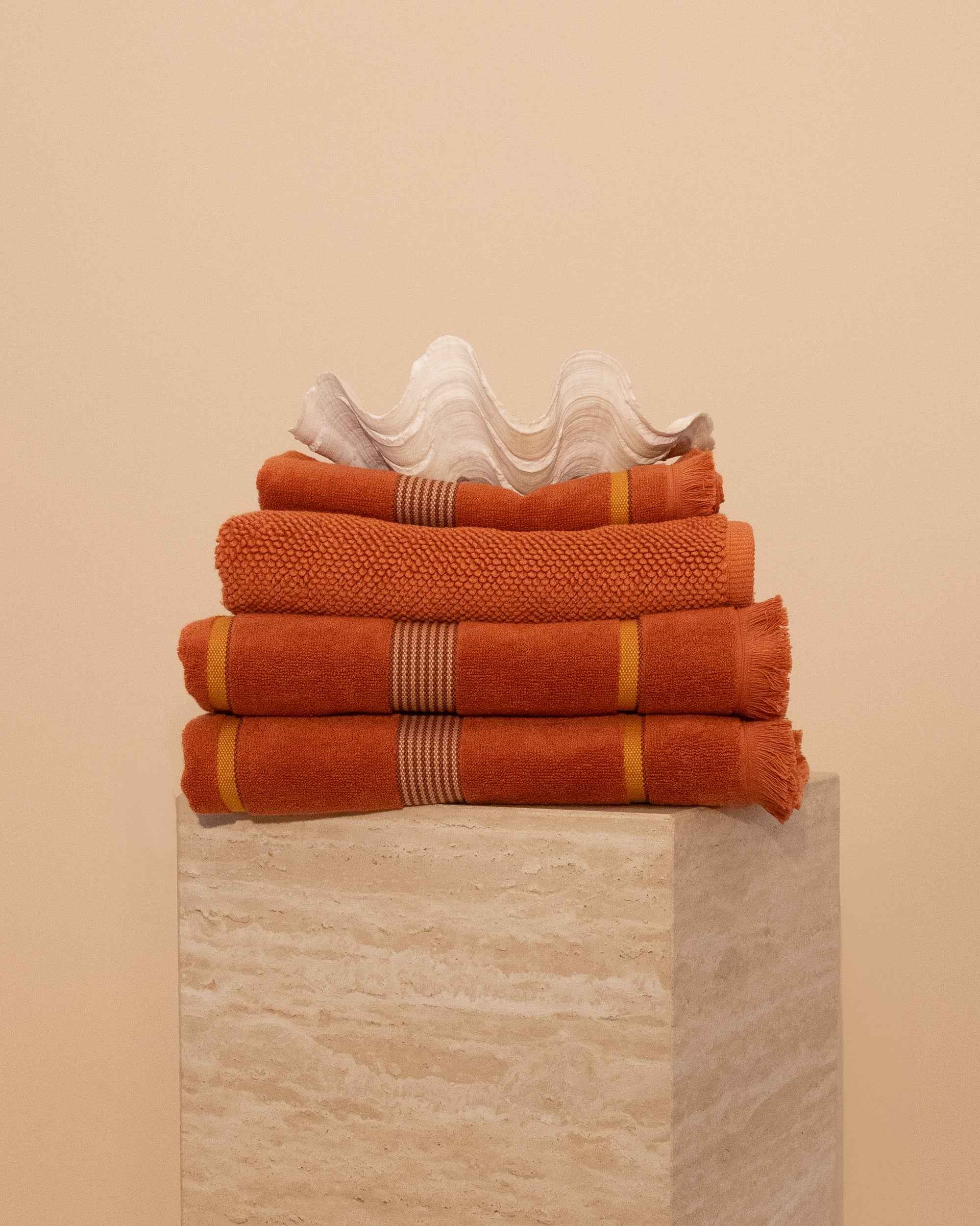 Kobn Tamarillo Bathroom Set featuring contrast stripes and fringing with 2 towels, 1 hand towel and 1 bathmat. 