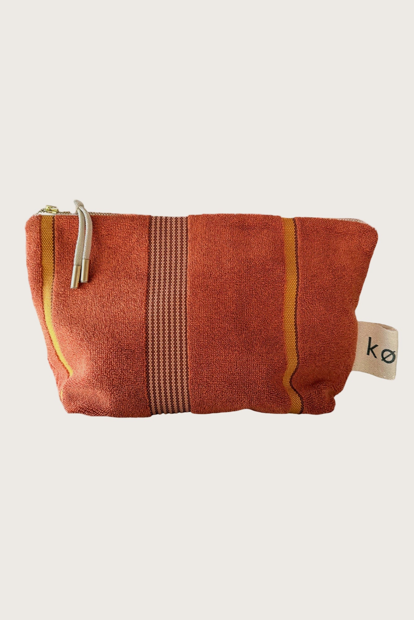 Kobn Tamarillo towelling pouch with stripes and feature zip pull for travel or everyday use. 