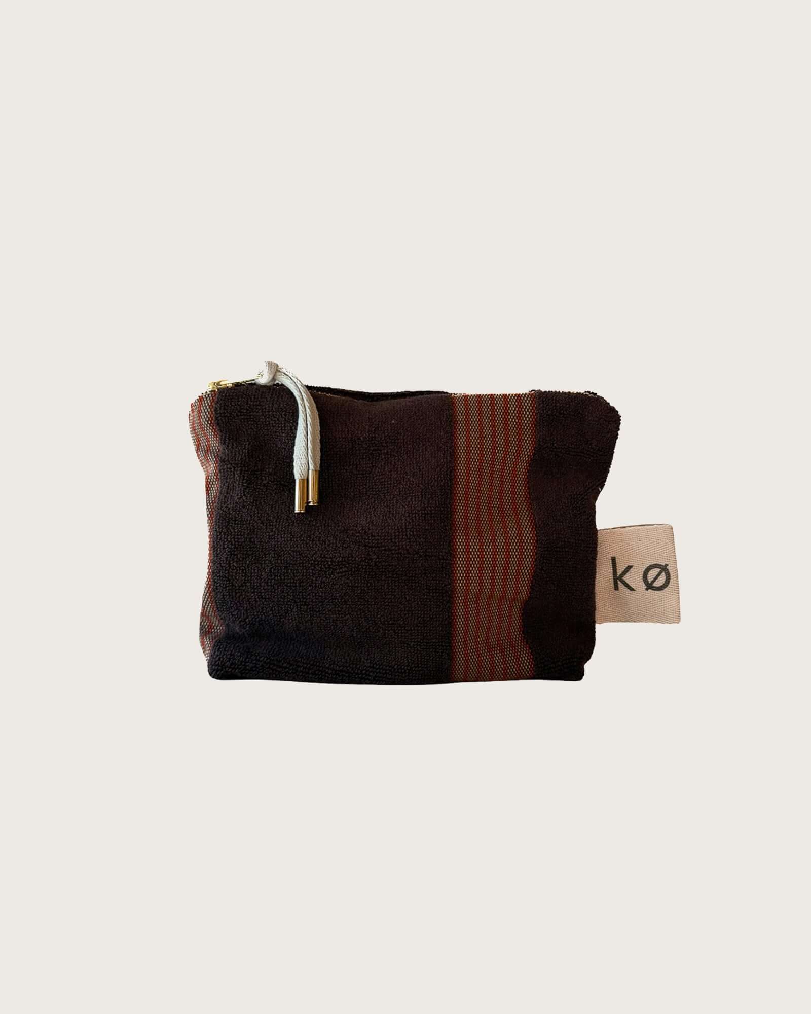 Kobn Umber towelling pouch with stripes, a herringbone label and feature zip tassle. 