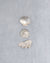 Three shells on a pale mist blue chunky cotton weave bathmat by Kobn