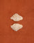 Clam shell pair on a textured cotton bath mat in Tamarillo colour by Kobn