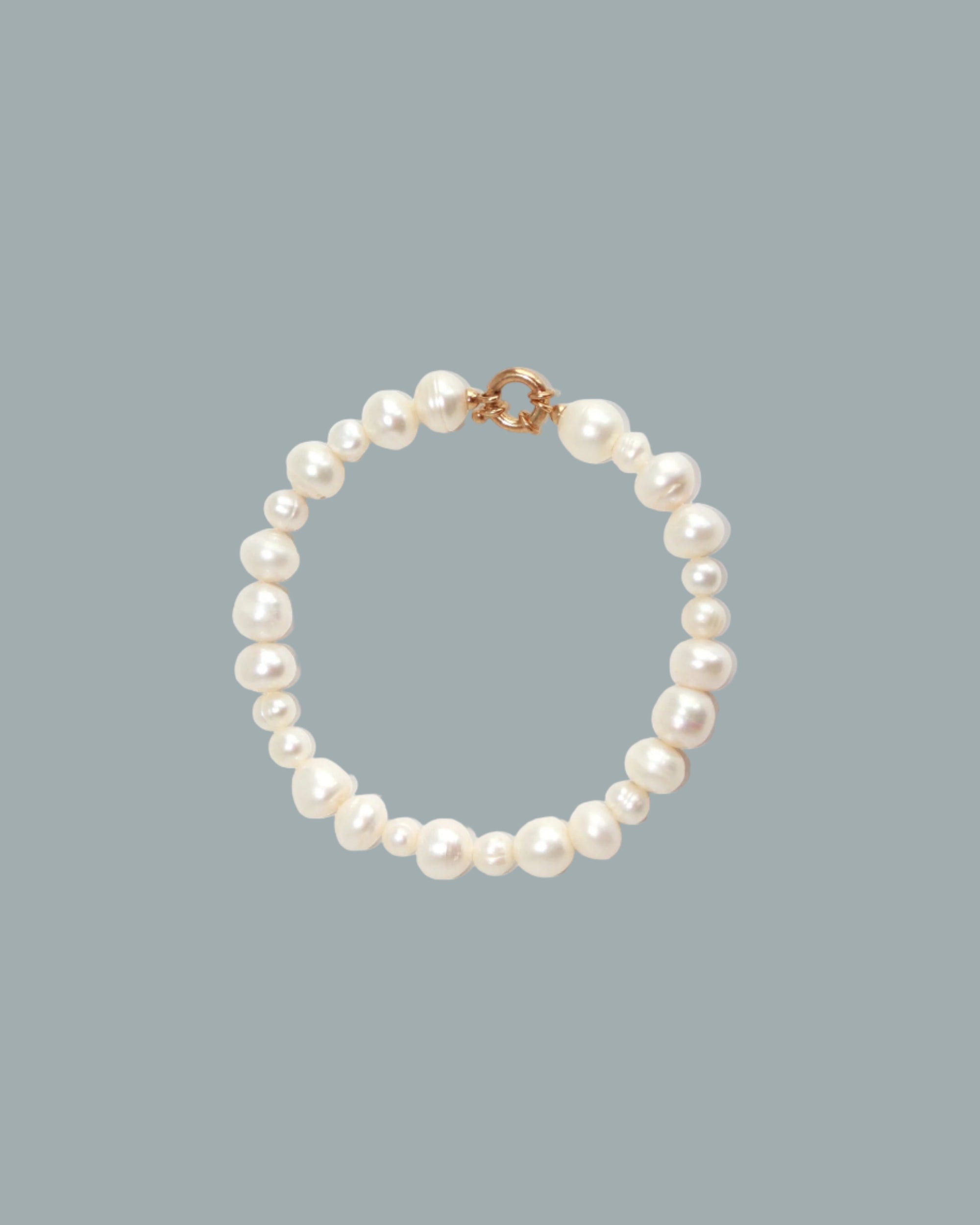 Pearl bracelet on a blue background