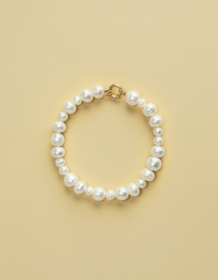 Pearl bracelet on a blue background