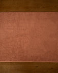 Clay bathmat laid flat on floorboards
