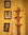 Wooden coat rack with a striped towel against a wall with framed pictures.