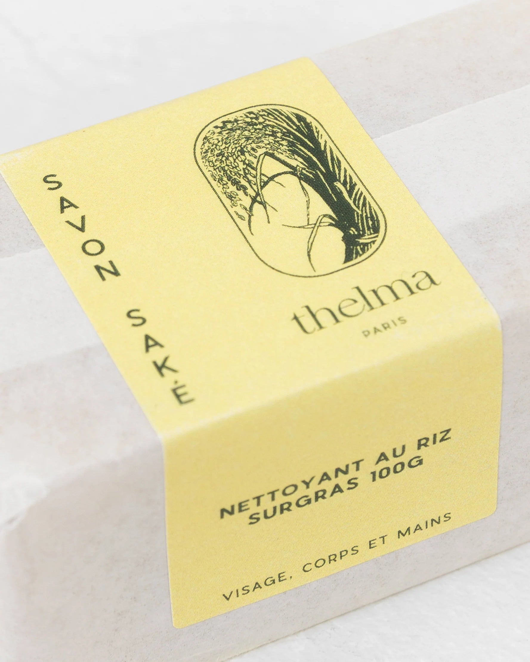 Bar of soap with 'thelma' packaging on a white background